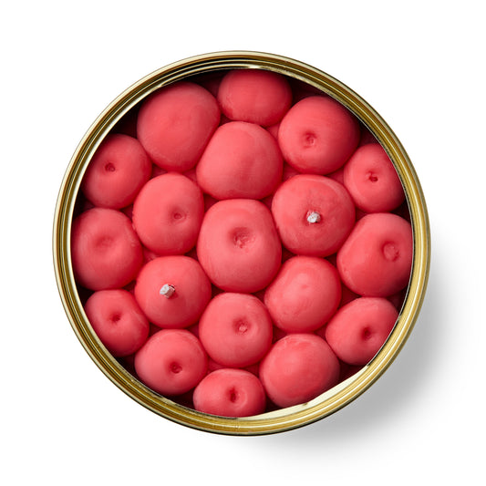 cherry shaped fruity scented candle in a gold tin on a white background