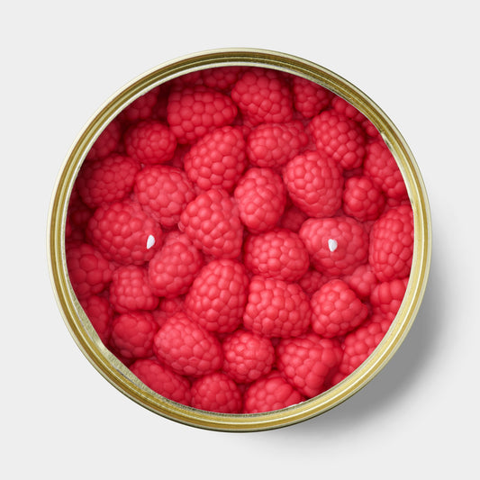 raspberry shaped scented candle in a gold tin