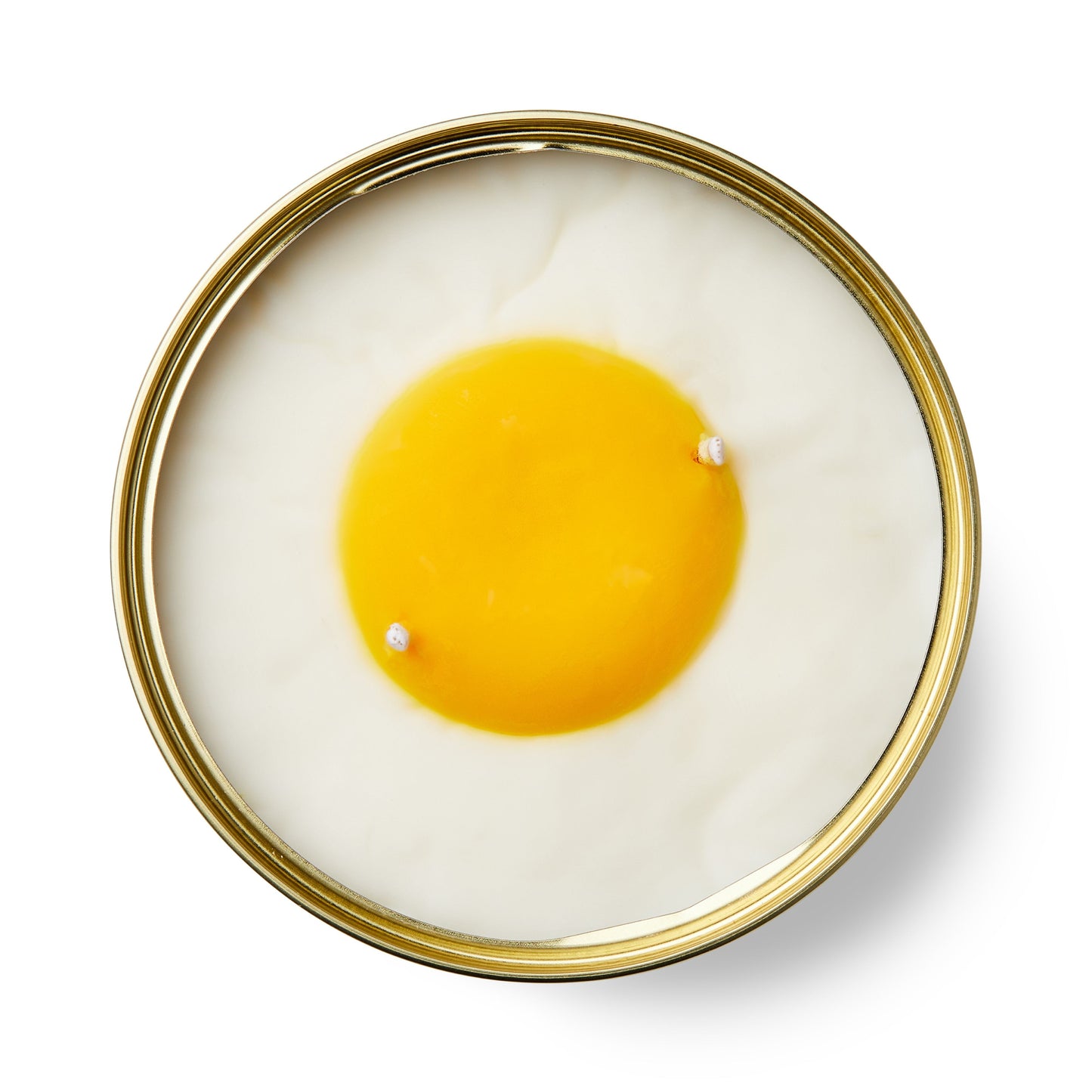 vanilla egg shaped candle in a gold tin on a white background