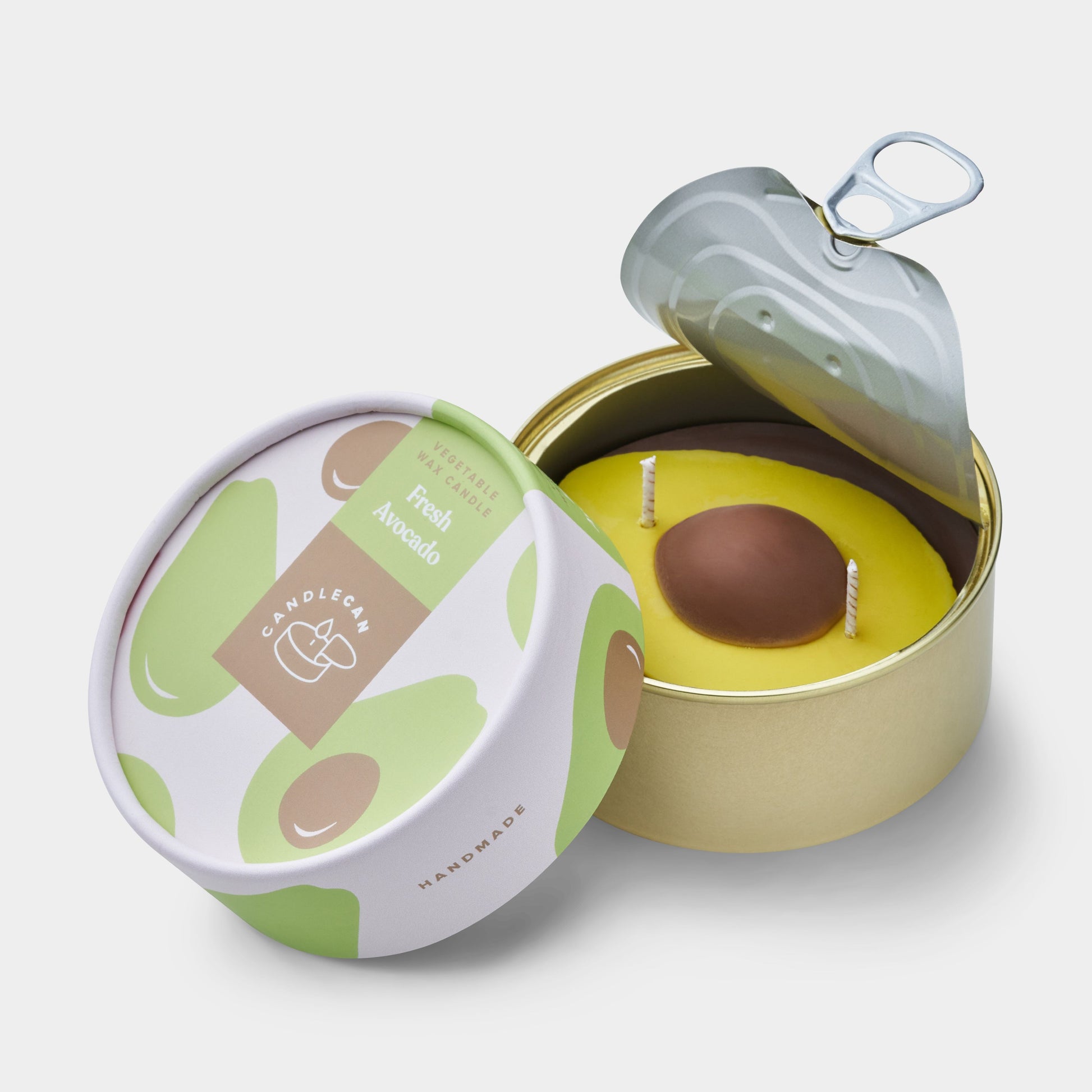 avocado shaped candle in a gold tin 
