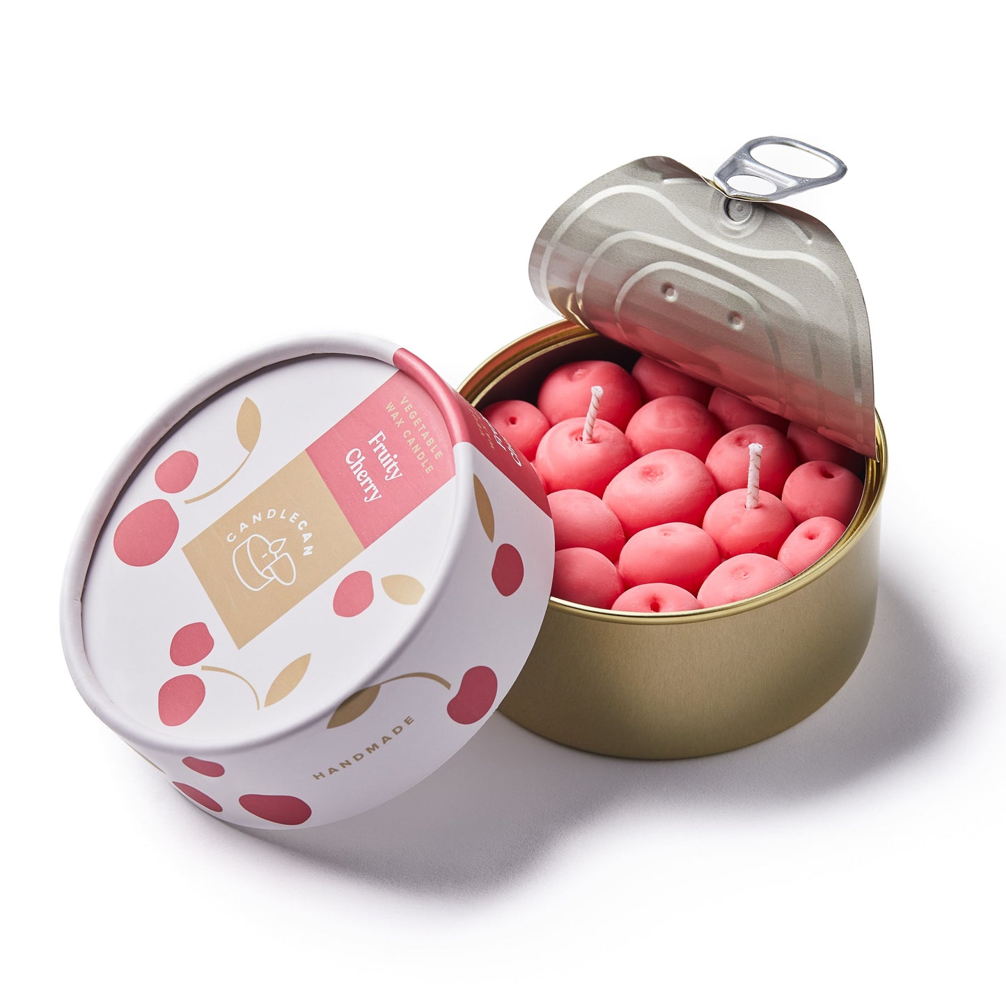 cherry shaped scented candle in a gold tin 