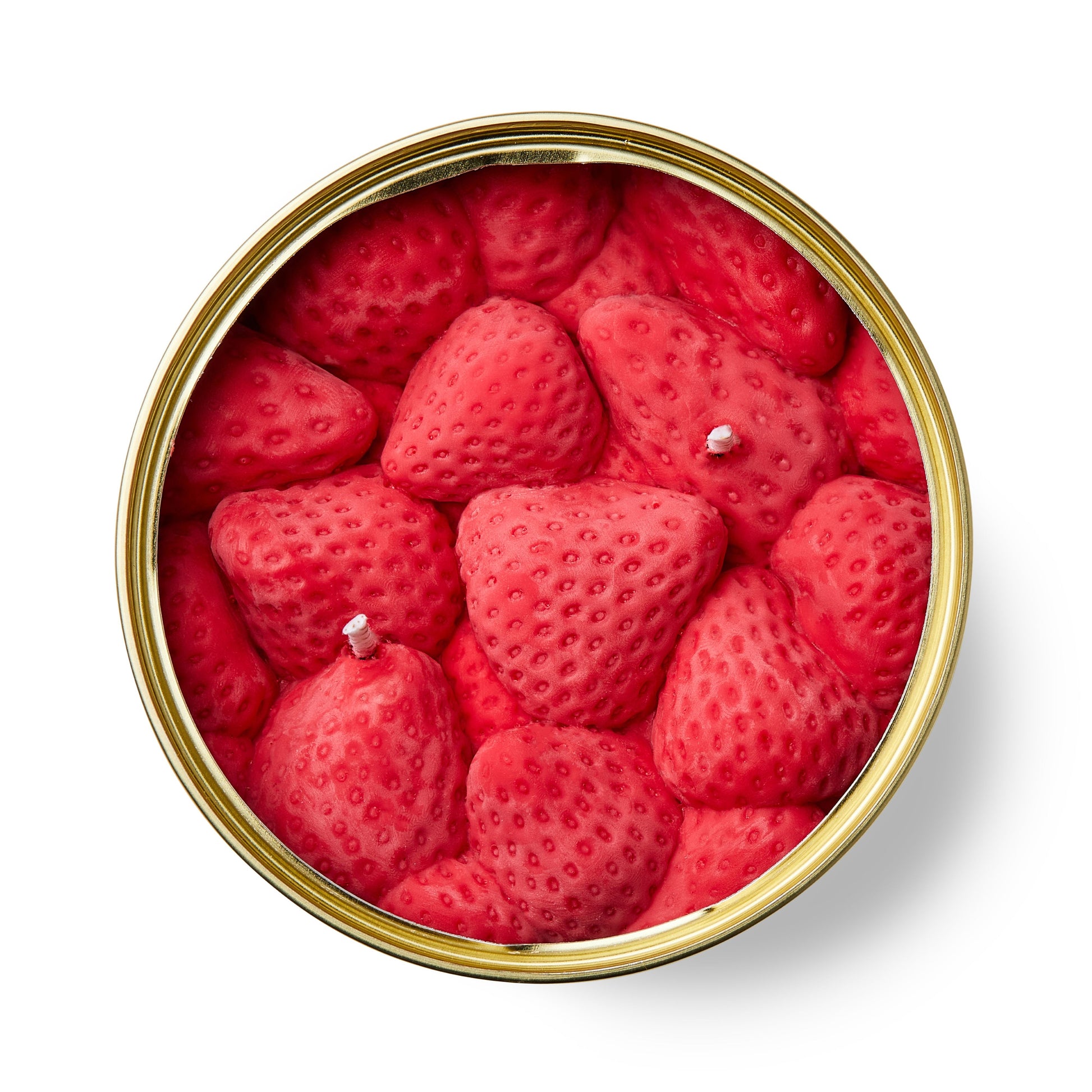strawberry shaped scented candle in a gold tin on a white background
